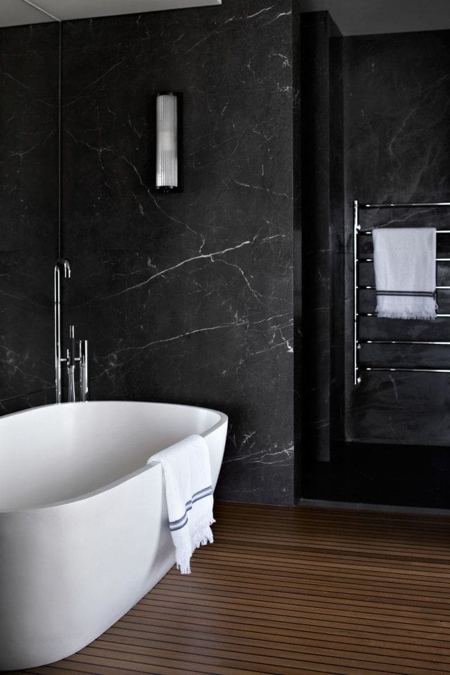 Black marble walls of bathroom