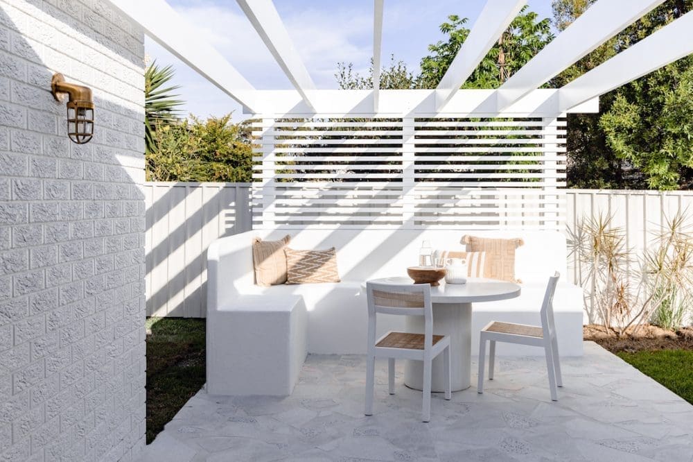 Outdoor dining space with built in seating