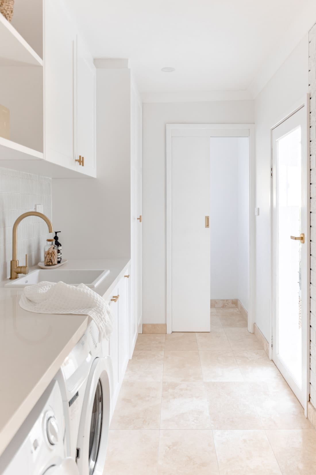 White and gold coastal laundry