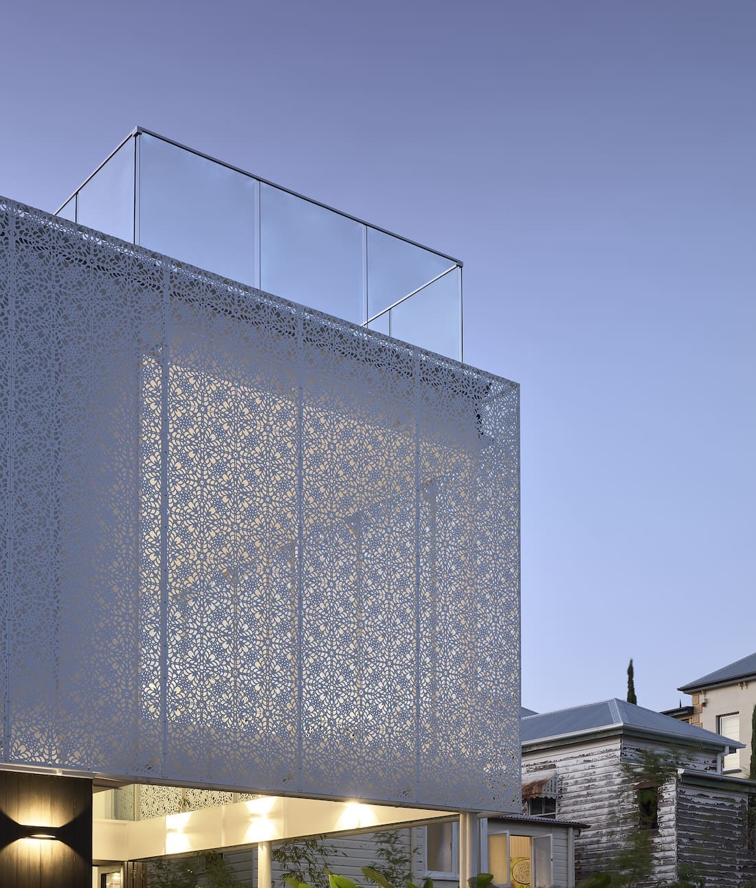 Exterior of White Lace home by night