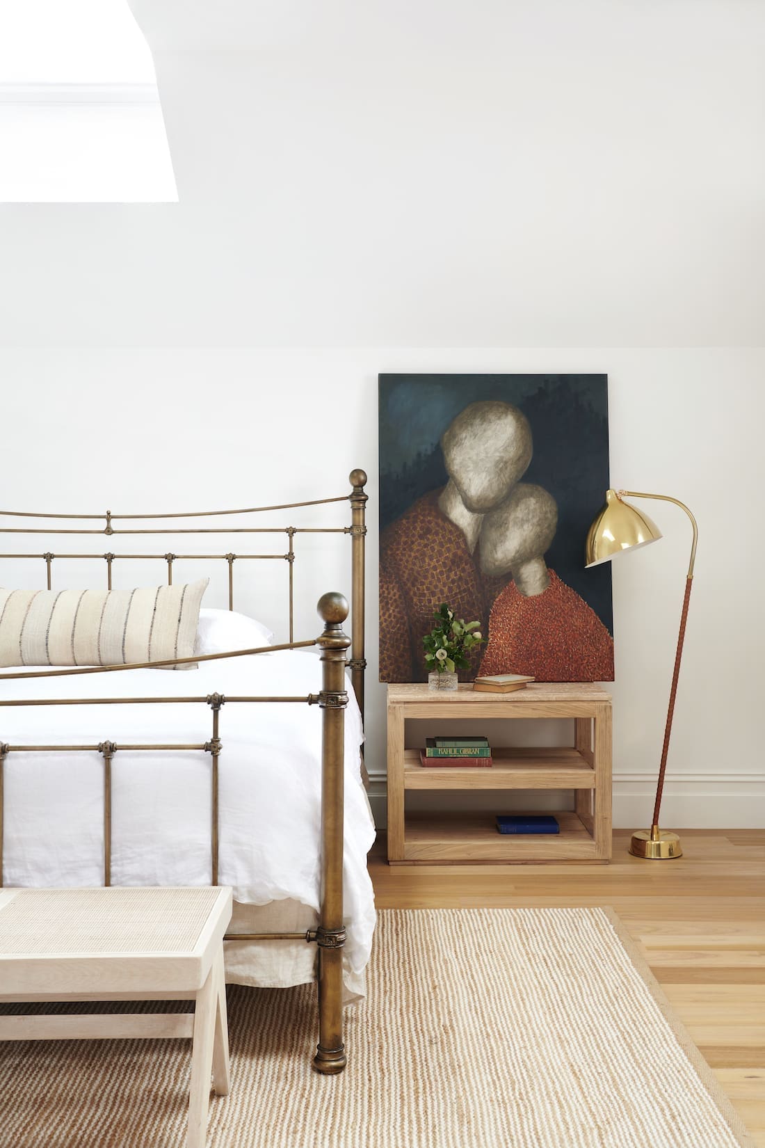 Bedroom with brass bed by The Stylesmiths