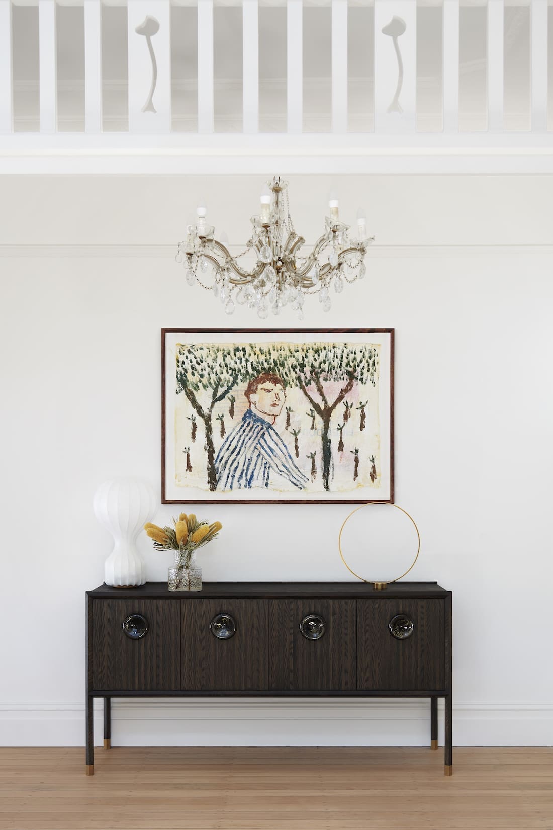 Hallway styling with art and sideboard by The Stylesmiths