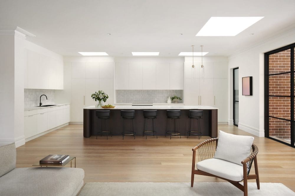 Extra long island bench in kitchen by The Stylesmiths