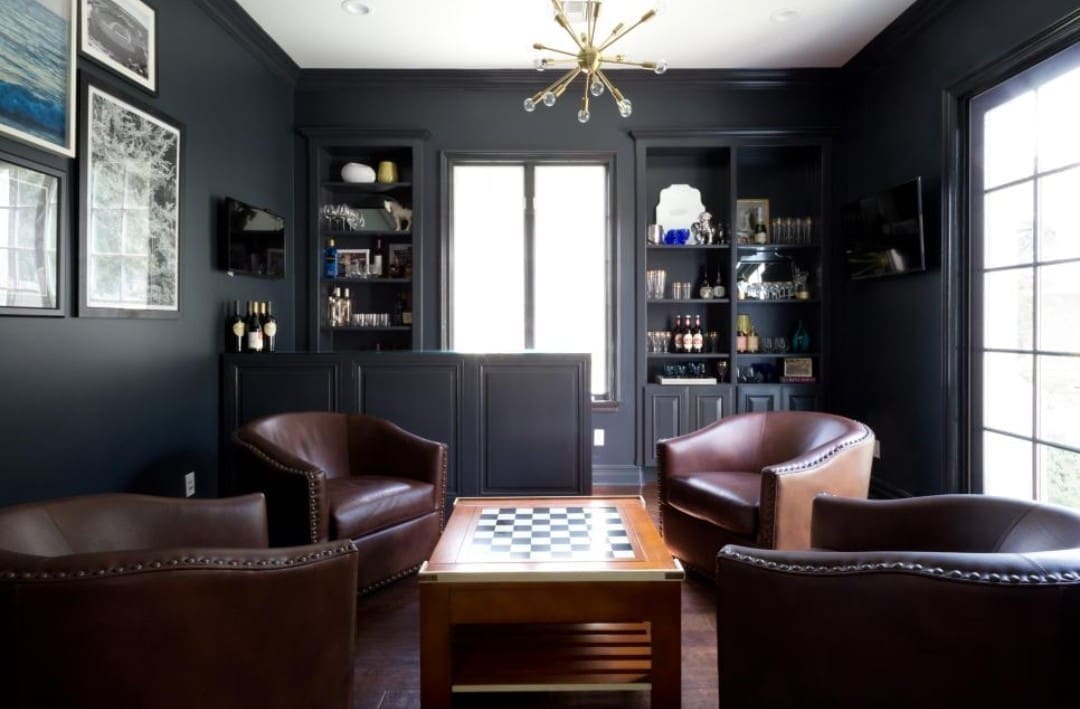 Man cave with checkers table and dark walls