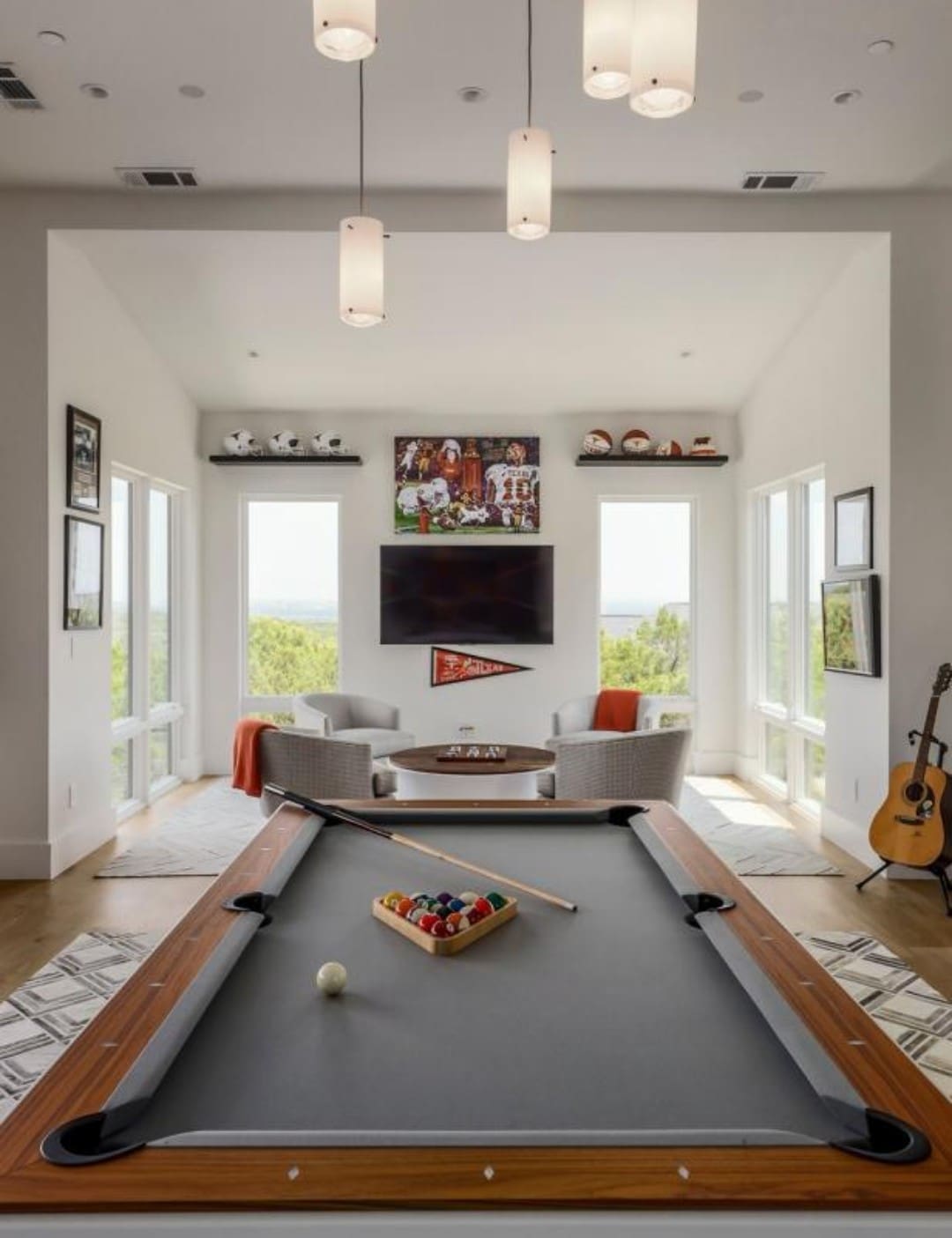 Pool table and sports memorabilia man cave