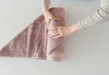 How to fold towels: Simple towel styling tricks to roll or fold towels Roll the bath towel tightly