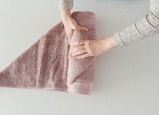 Roll the bath towel tightly