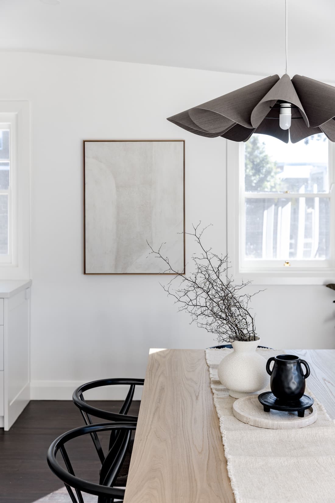 Wavy fabric pendant light above dining table