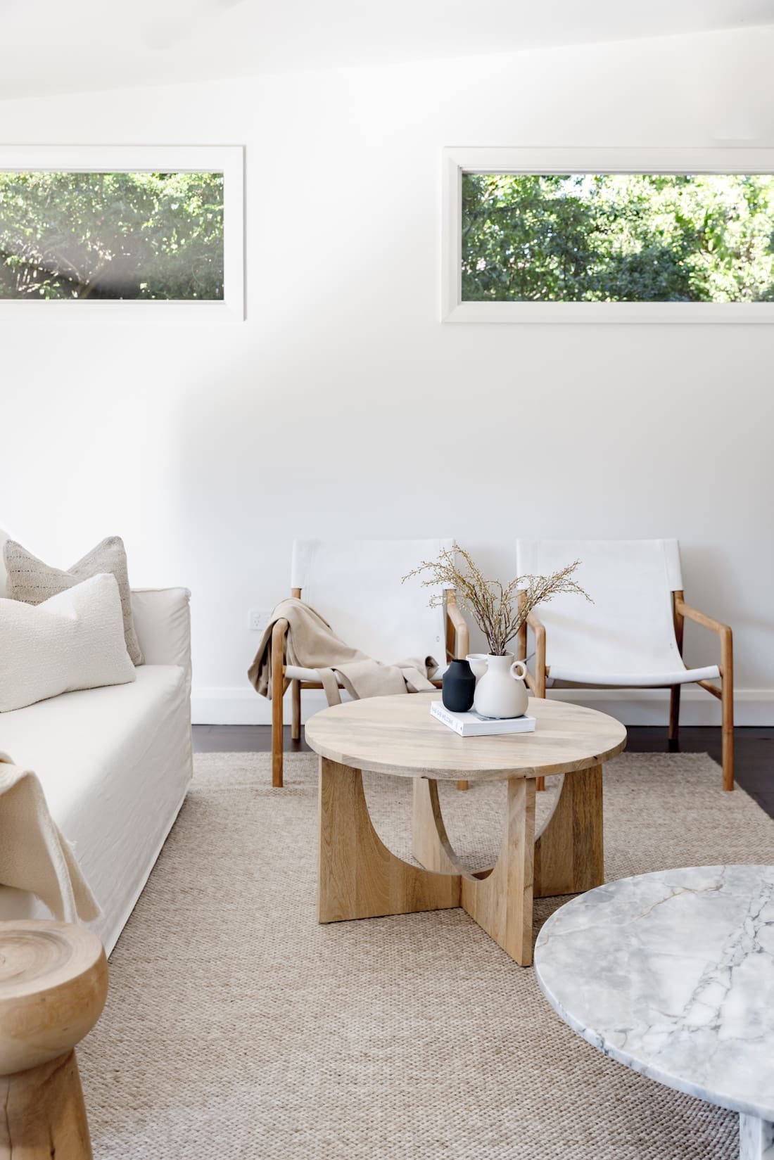 Living area with curved coffee table