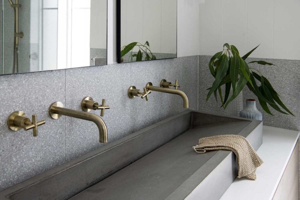 Concrete basin with brass tapware