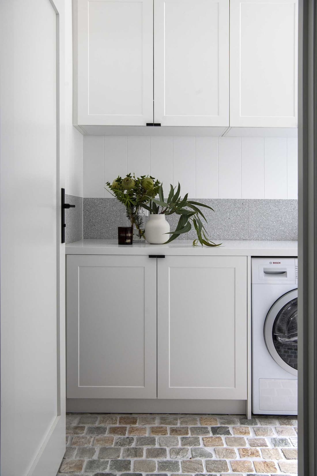 White laundry with cobblestone flooring