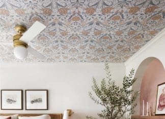 Wallpapered ceiling in bedroom