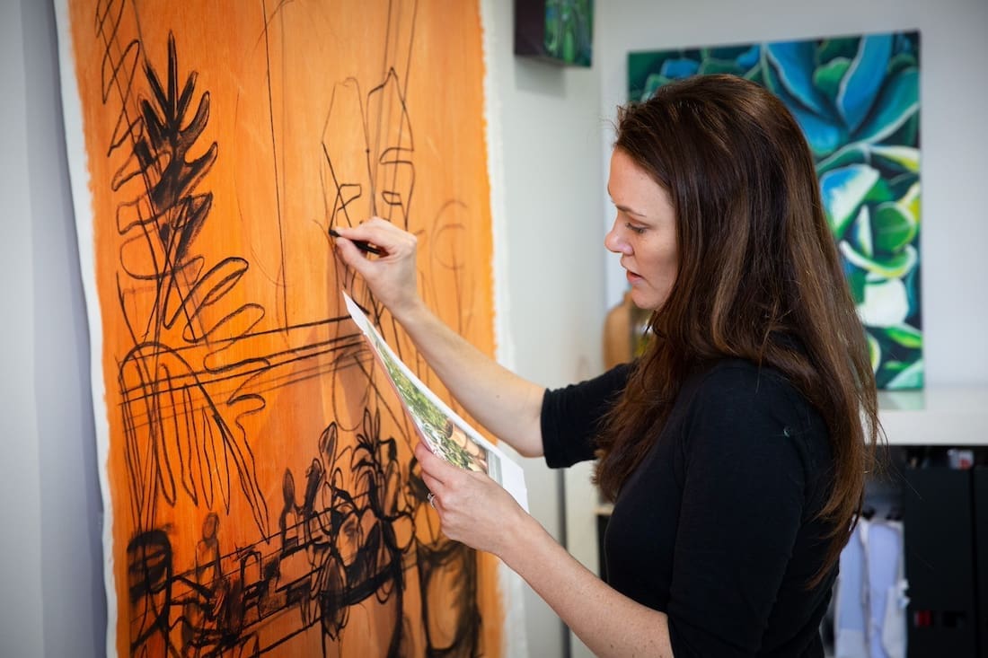 Sarah Abbott sketching from a photograph
