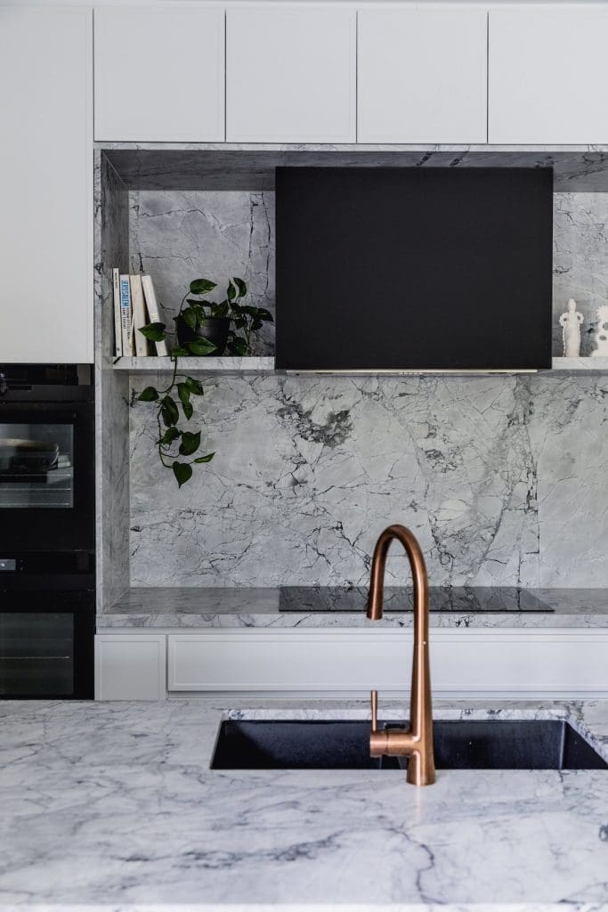 Wattle Valley Road home by Picchio Interiors marble backsplash in kitchen