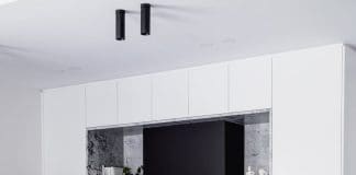 Black batten curved island bench in kitchen at Wattle Valley Road by Picchio Interiors