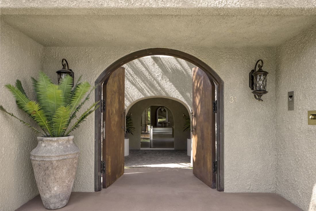 Curved entry doorway to Ruin X house