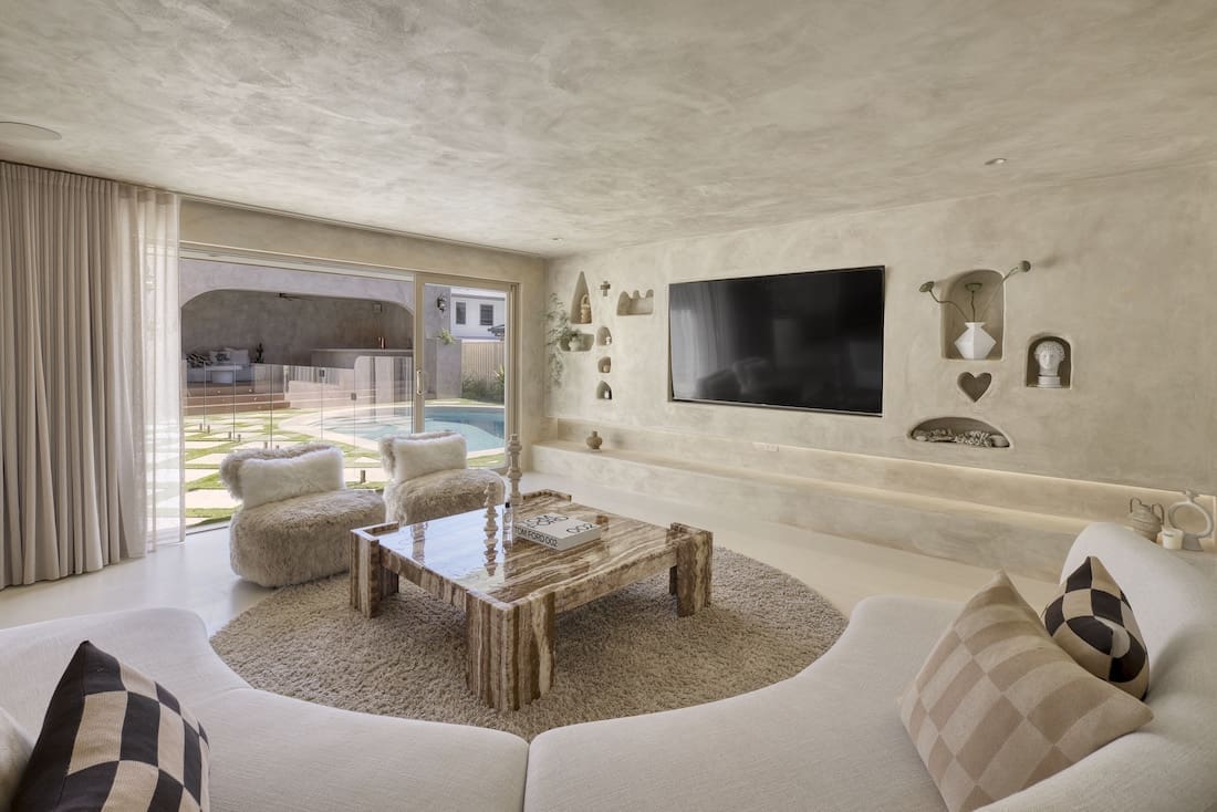 Living room with marble coffee table in Ruin X home