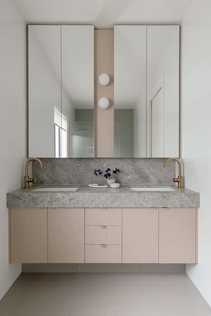 Bathroom with stone benchtops in bathroom makeover