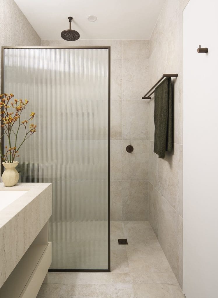 Fluted glass shower screen in Tribeca Brewery apartment by The Stylesmiths