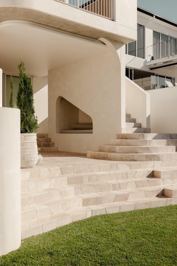 Outdoor staircase and wall nook seating space at Gréce