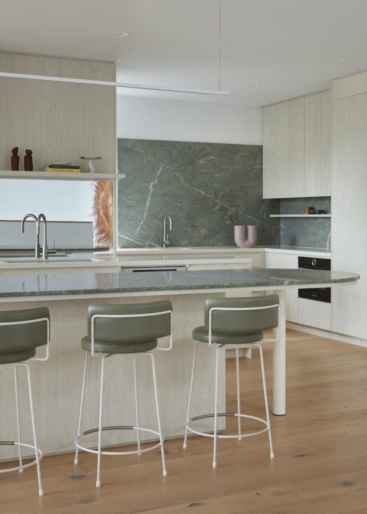Kitchen island with green stone benchtops