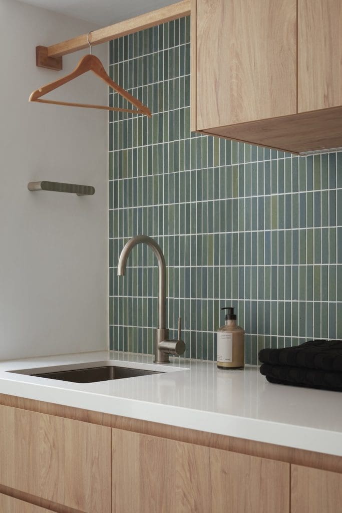 Green kitkat tiles in laundry