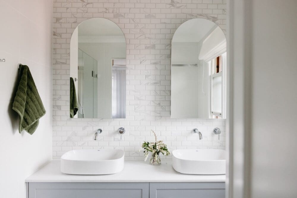 Classic double vanity bathroom in Hamptons inspired home
