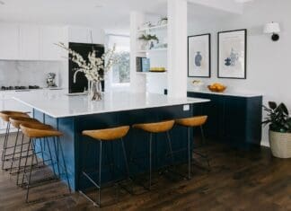 Hamptons style kitchen with blue kitchen island bench