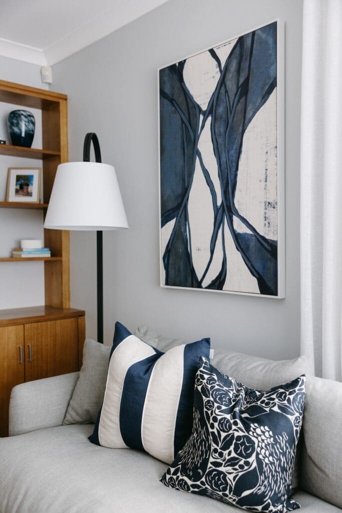 Hamptons style cushions and artwork in living room
