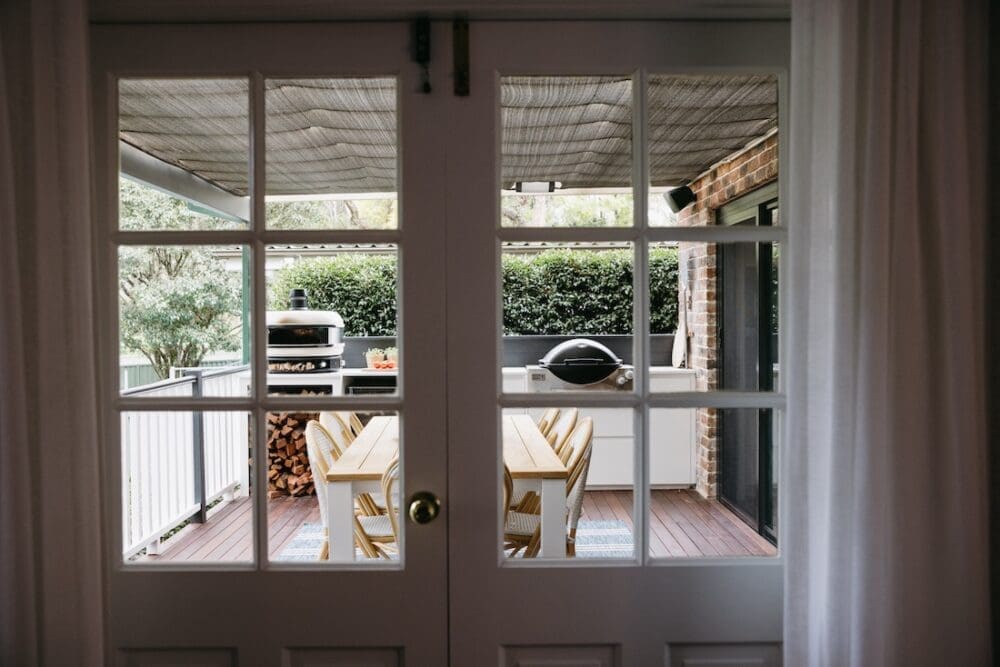Glass doors to external deck and dining area