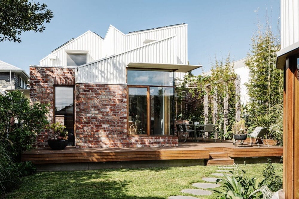 Red brick and white roofline exterior at Chatterbox House
