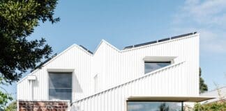 White exterior and red brick of Chatterbox House