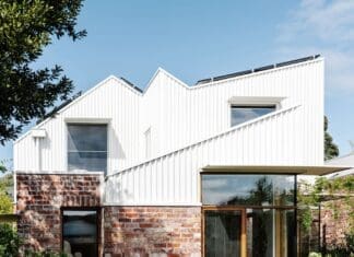 White exterior and red brick of Chatterbox House