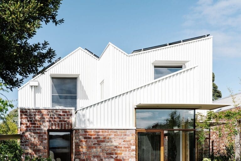 White exterior and red brick of Chatterbox House