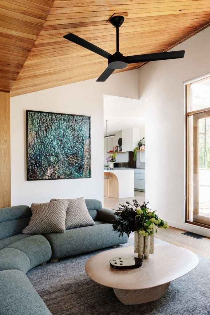 Curved sofa in living room at Chatterbox House