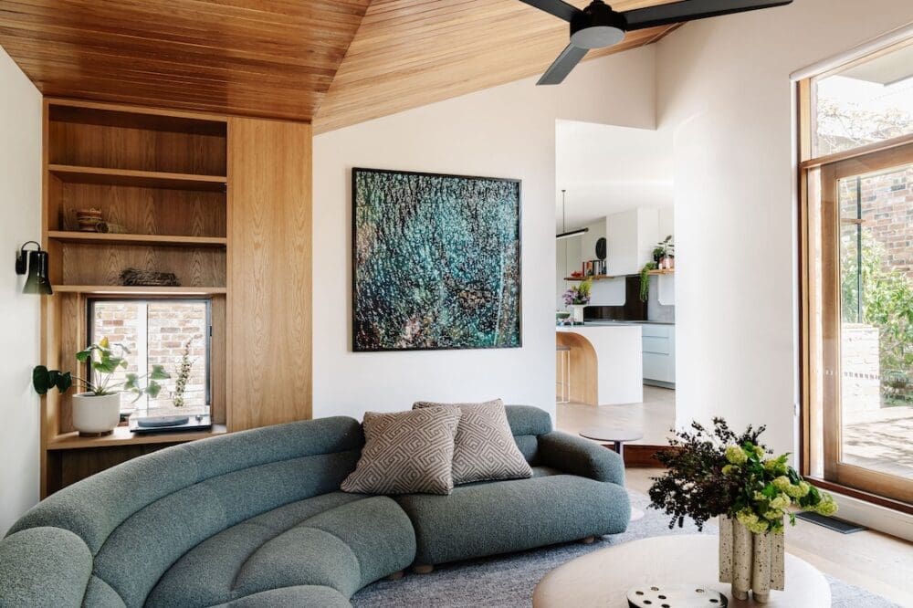Living room at Chatterbox House with curved sofa