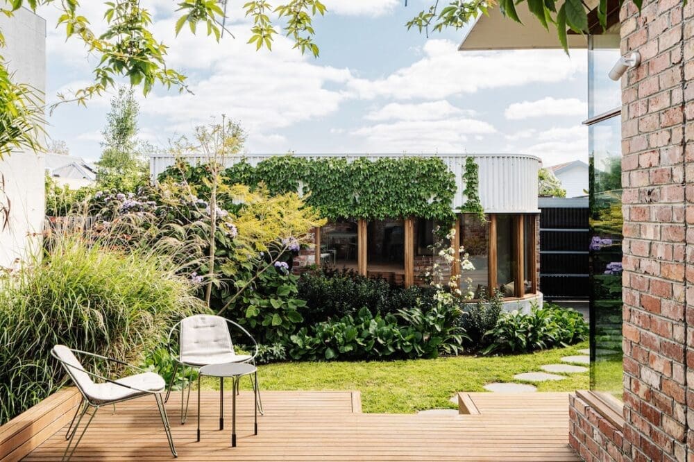 Outdoor deck looking over garden and grannyflat at Chatterbox House