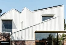 Everything you need to know about roof plumbing for home maintenance White and red brick exterior of Chatterbox House