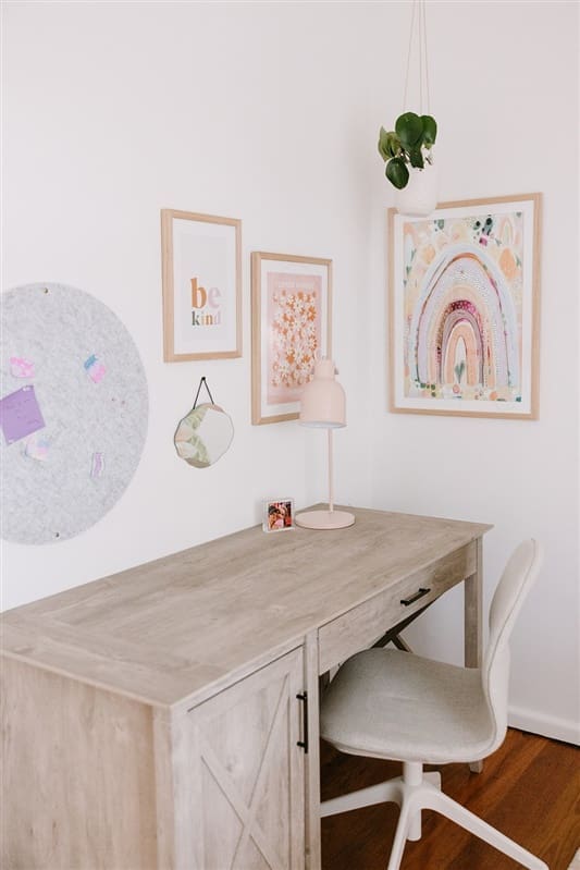 Study nook in girls bedroom with gallery wall