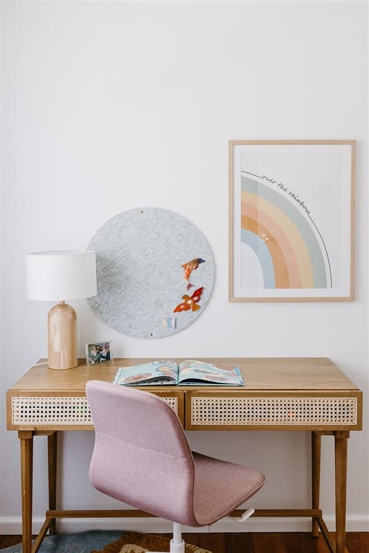 Girls desk area in bedroom with pink desk chair