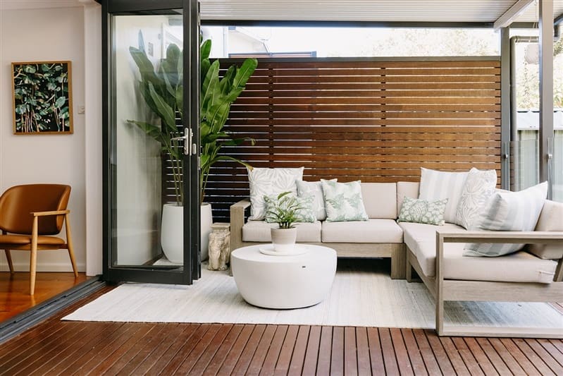 Timber decking with outdoor sofa and coffee table