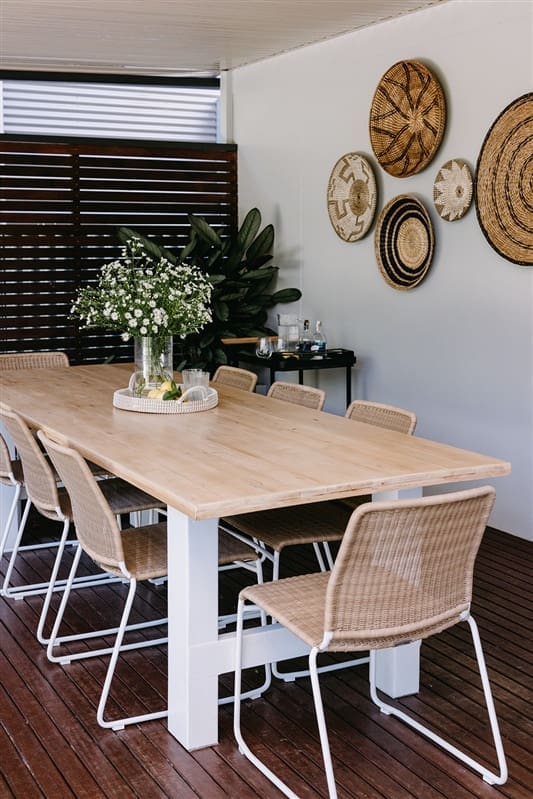 Outdoor dining setting with woven chairs