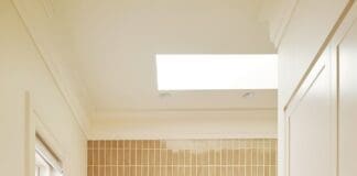Luxe bathroom ensuite with marble vanity and double organic mirror