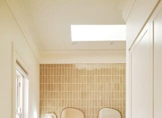 Luxe bathroom ensuite with marble vanity and double organic mirror