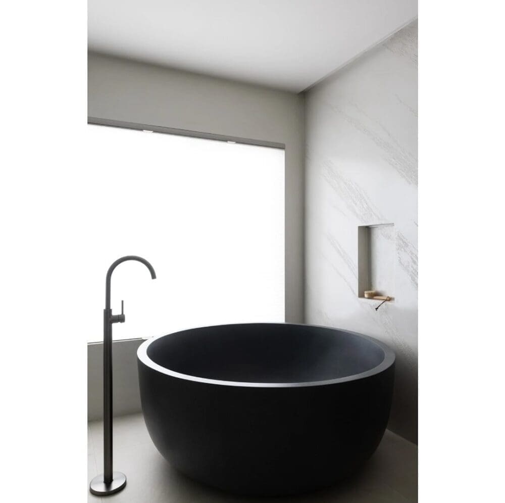Modern bathroom renovation with black round bath