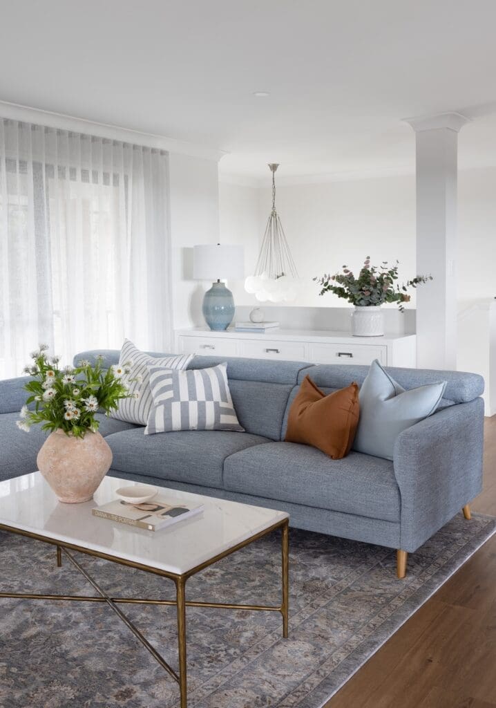 Modern country sitting room with blue couch