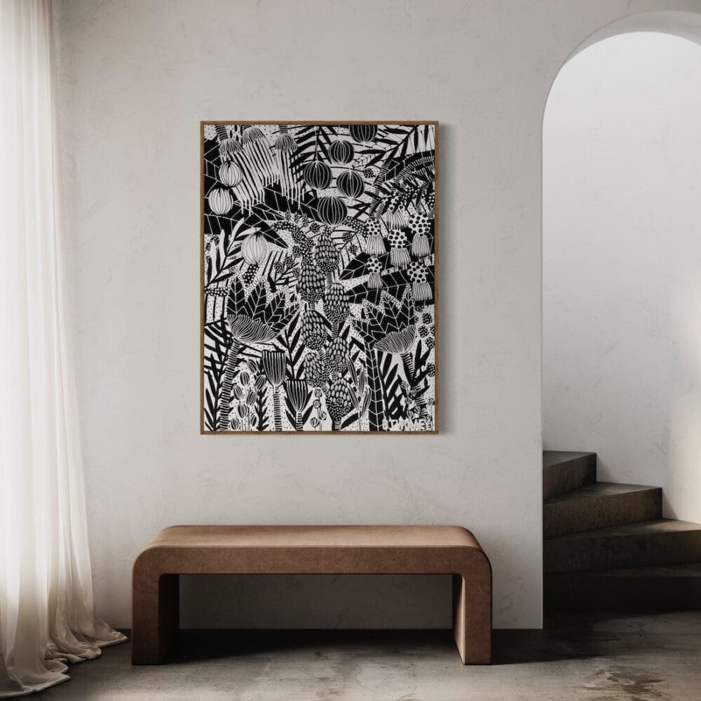 Black and white botanical art by B Twomey above a bench seat