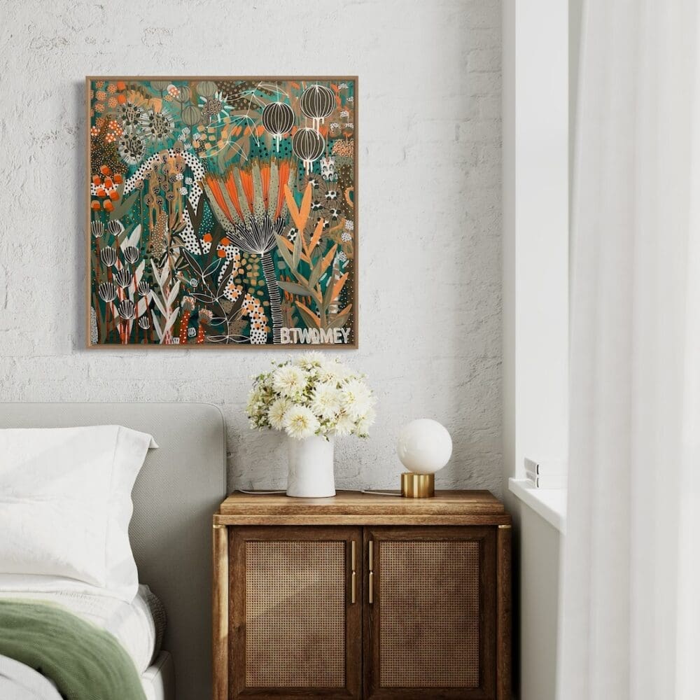 Colourful botanical artwork from B Twomey above a bedside table in bedroom