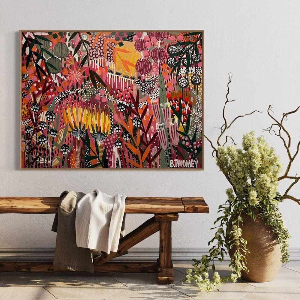 Colourful botanical artwork from B Twomey above a timber bench seat