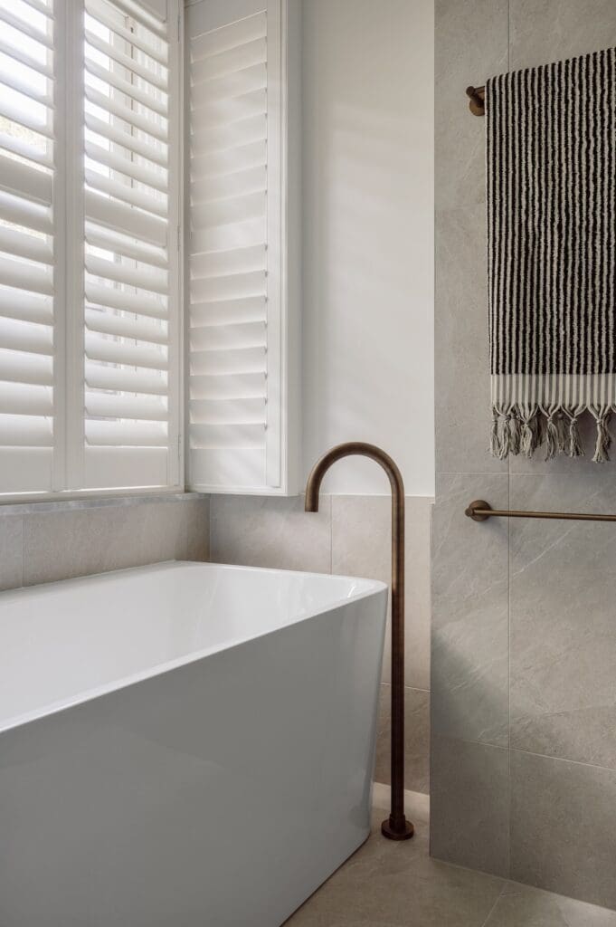 Bath spout and bronze towel rail